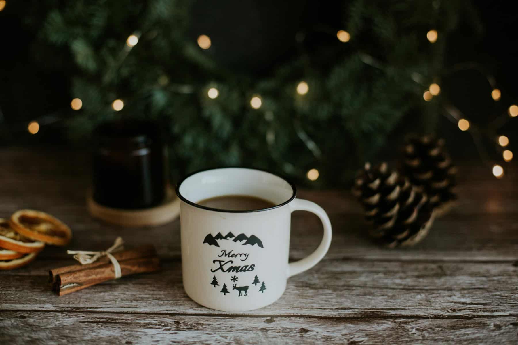 Cup of tea at Christmas in front of tree