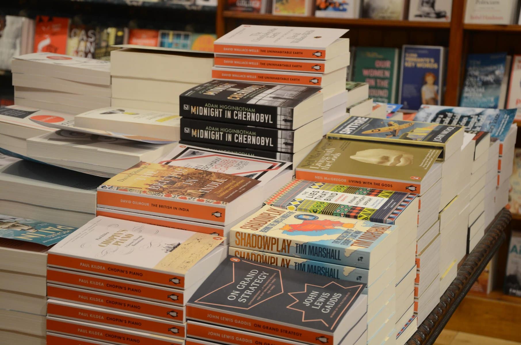 stacks of non-fiction books in a bookshop