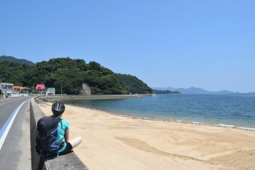 Sitting by the Seto Inland Sea while cycling the Shimanami Kaido